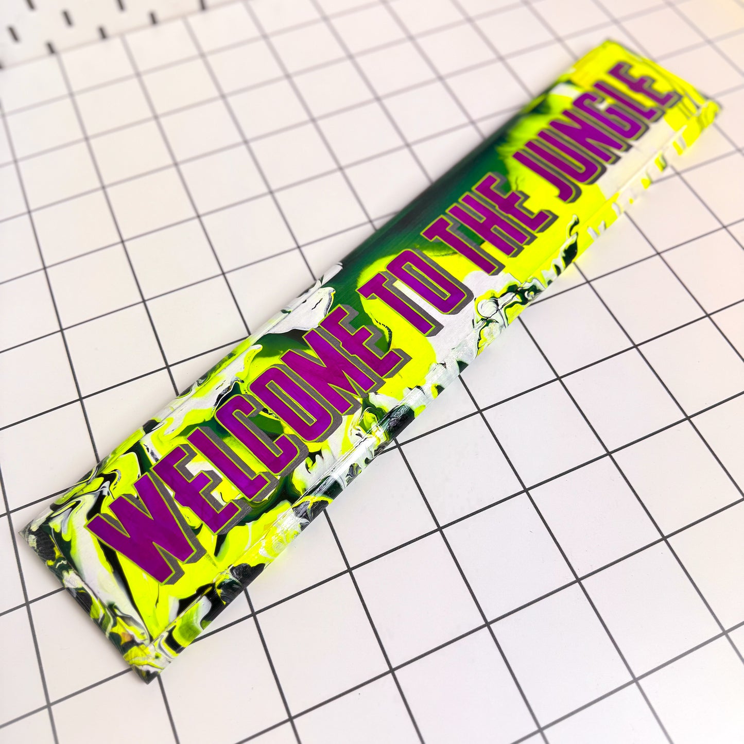 The Stoofy Store Hand-painted ‘Welcome to the Jungle’ sign with green background, animal print, and bold lettering, finished in gloss.