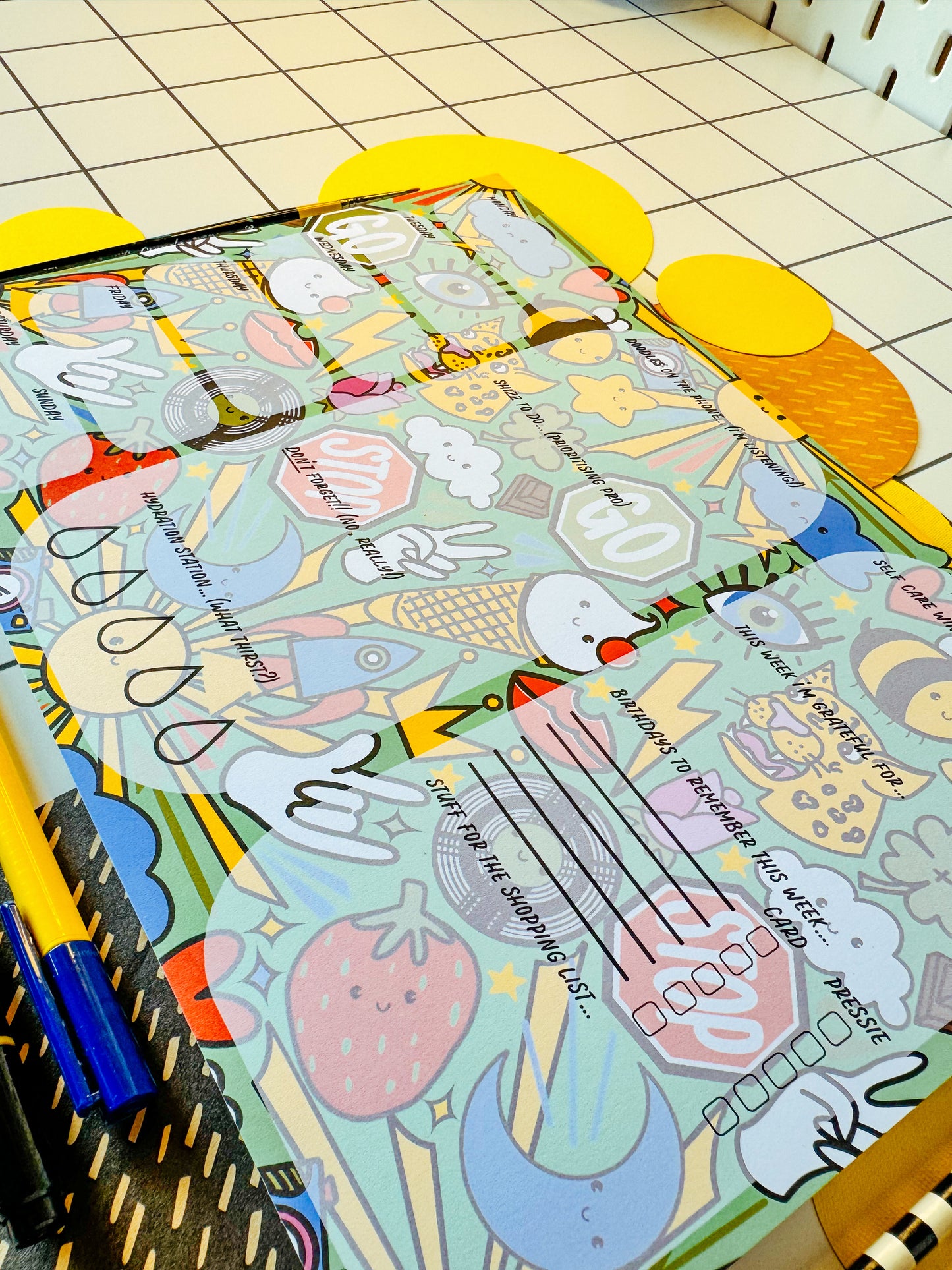 A4 desk planner. Organisation. Office. Organisation. Alternative stationary. Illustrated pattern including: suns, leopards, records, hearts, ice cream, crown, peace hand sign, lips, rocket, moon, strawberry, rose, cloud, four leaf clover, stop sign, go sign, eye, bumble bee, lightning, camera, chocolate.