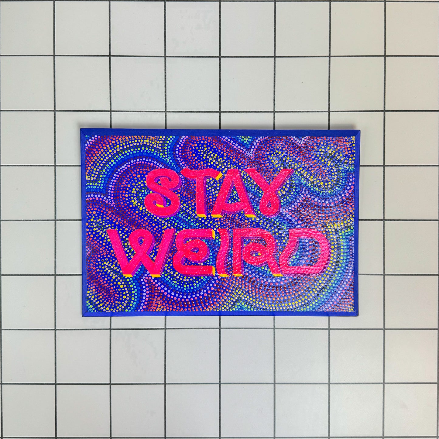 Main view of Stoofy's “Stay Weird” hand-painted wooden sign – vibrant and quirky wall sign-writing art for bold, maximalist homes and eccentric spirits. A celebration of self-expression and personality by artist, Stoofy. Limited edition, original, human-made contemporary art.