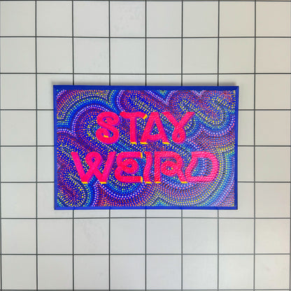 Main view of Stoofy's “Stay Weird” hand-painted wooden sign – vibrant and quirky wall sign-writing art for bold, maximalist homes and eccentric spirits. A celebration of self-expression and personality by artist, Stoofy. Limited edition, original, human-made contemporary art.