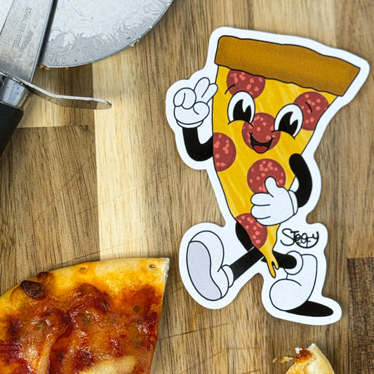 Stoofy's die-cut vinyl sticker of a cartoon pizza slice with a face and hands giving a peace sign. The sticker is placed on a wooden surface with a real pizza slice in the background. Design and copyright owned by Stoofy. Last few remaining!