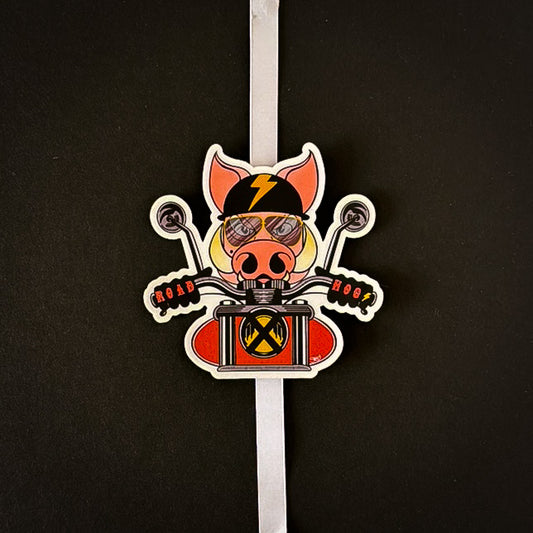 Stoofy's die-cut vinyl sticker featuring a cartoon pig wearing a helmet and riding a motorcycle, with gloves that state Road Hog. Design and copyright owned by UK Artist, Stoofy.