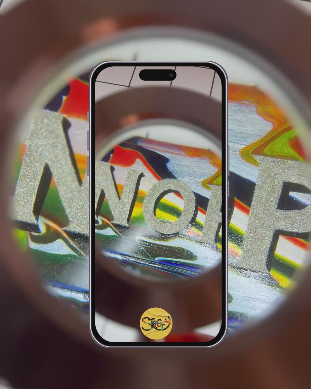 Hand-painted 'NOPE TO TAUPE' sign being looked at underneath a magnifying glass, highlighting yhr bold, colourful, glittery lettering, background and shiny gloss finish.