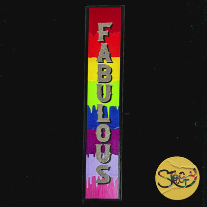 “Fabulous” is a striking, vertical hand-painted sign adorned with a rainbow of bright, dripping colours and glittering lettering. It's a bold statement piece that celebrates individuality and joy. By The Stoofy Store