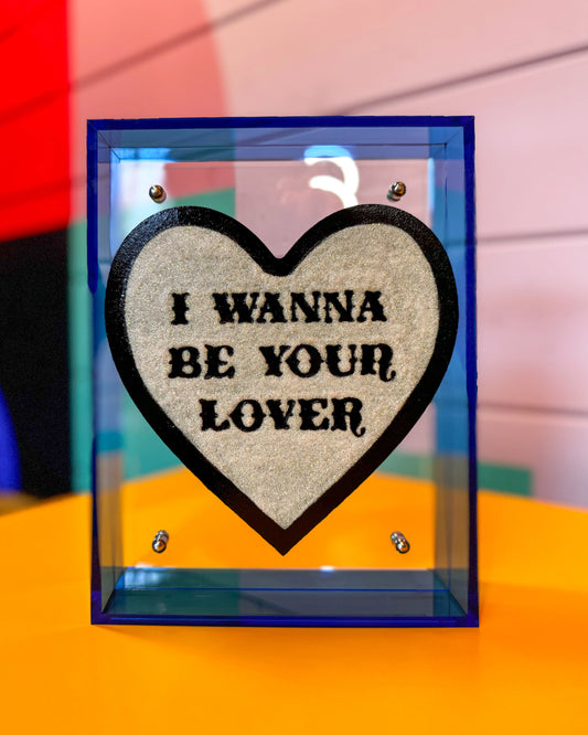 I Wanna Be Your Lover artwork displayed on shelf in maximalist interior by Stoofy