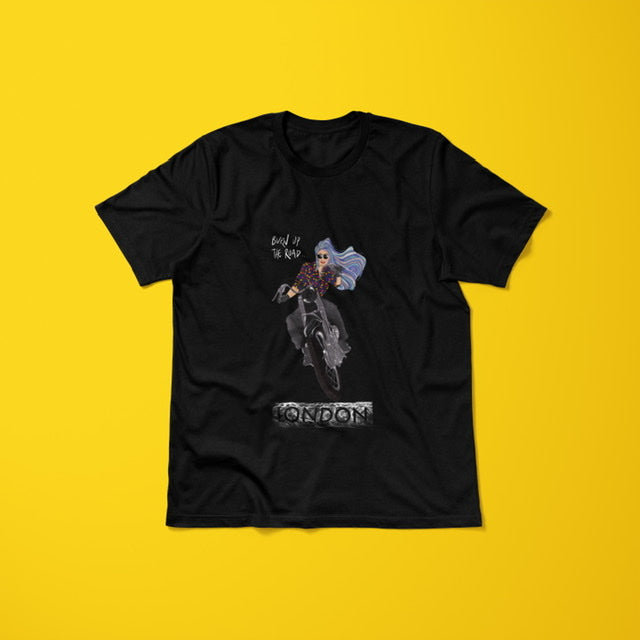 A black unisex t-shirt with a graphic illustration of a woman riding a motorbike and the text 'LONDON' displayed beneath the artwork. Design is on the back of the tshirt. Design artwork and copyright owned by Stoofy. Apparel perfect for bikers, motorbike motorcycle enthusiasts and lady bikers